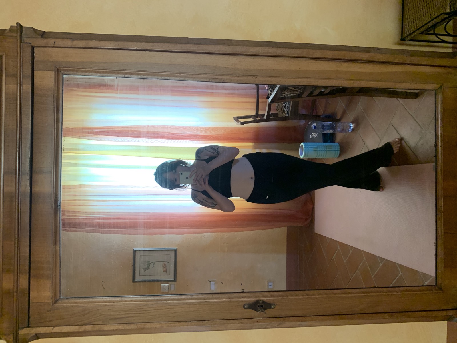 Lucy's mirror selfie in workout clothes, phone covering her face