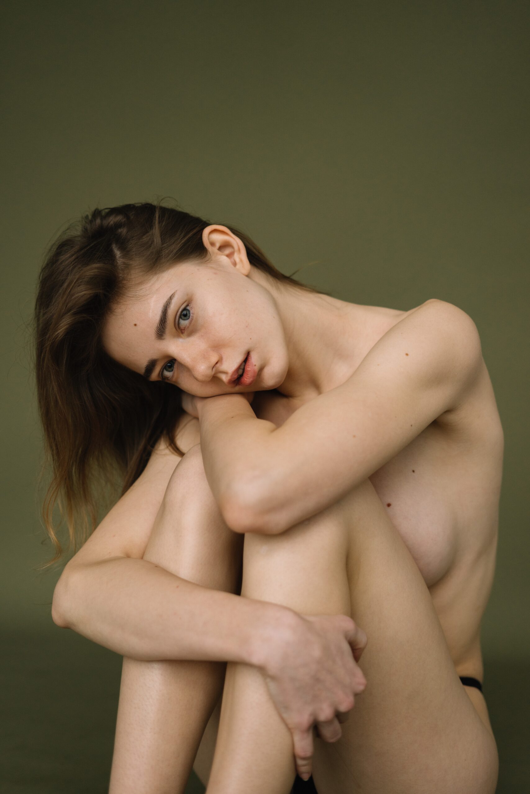 Photo by Ekaterina Belousova: https://www.pexels.com/photo/a-topless-woman-sitting-on-the-floor-8047169/